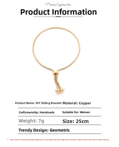 Detail of adjustable gold copper snake chain bracelet with sliding bead closure