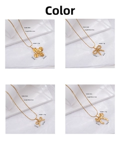 Detail view of four gold bow and flower necklaces with snake chain dimensions