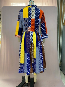 Detailed back view of a patchwork print midi dress featuring vibrant geometric patterns
