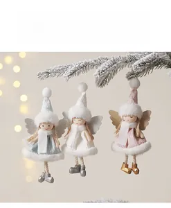 Detailed trio of plush Christmas angel dolls with glitter wings hanging on snowy pine branches