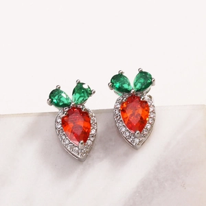 Cute red zircon strawberry stud earrings in 18K gold plated copper on marble background