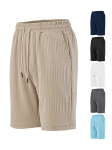 Detail showing waffle knit texture and adjustable drawstring on men's casual shorts