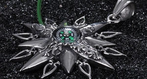 Silver compass pendant necklace for men in polished stainless steel on black background