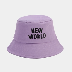 Detailed close-up of a purple cotton bucket hat featuring black NEW WORLD embroidery