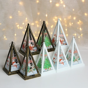 Pyramid Christmas lanterns with LED candles featuring Santa and reindeer holiday patterns