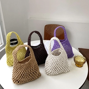 Handwoven cotton rope tote bag available in five natural colors with a hollow mesh design