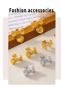 Detailed macro view of gold and silver bow stud earrings with sparkling crystal accents