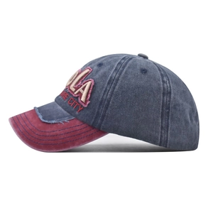Side view of retro baseball cap featuring 3D towel embroidery and distressed details