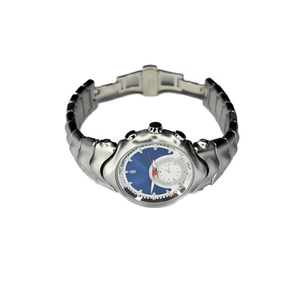 Macro detail of Y2K vintage irregular silver metal watch with blue dial and date display