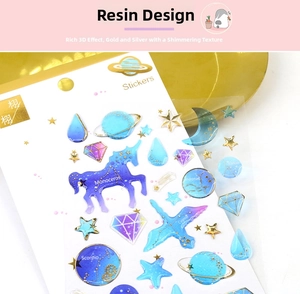 Detail of 3D crystal epoxy stickers featuring gold stamping in star and unicorn shapes