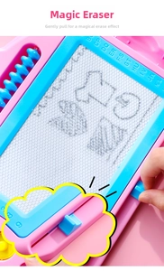 Detail of pink magnetic drawing board with blue abacus beads and sliding eraser bar