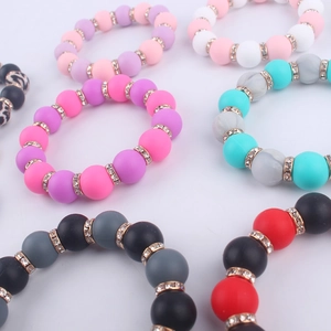 Multi-colored beaded silicone wristlet keychains with rhinestone spacers and tassel charms