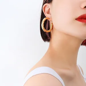 French style gold twisted hollow hoop earrings for women in 18k gold plated titanium steel