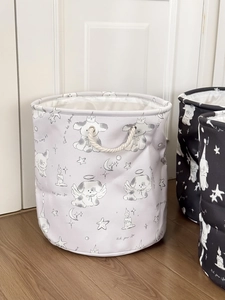 Detail of cute star moon puppy laundry basket with thick cotton rope handles and canvas lining
