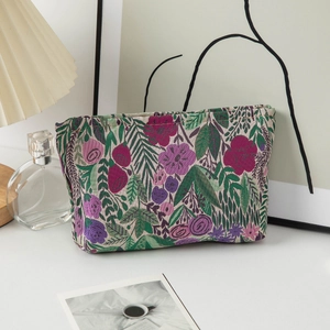 Detail of floral jacquard makeup bag with vintage embroidery in a lifestyle setting