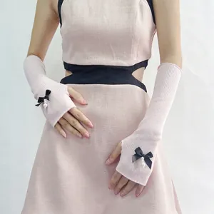 Pink knit arm warmers with black silk bowknot and pearl charm for JK Lolita style