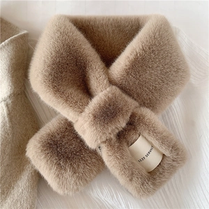 Detail of camel faux rabbit fur scarf showing plush texture and cross-over fastening design