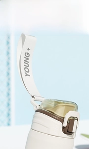 Detail of PPSU water bottle showing locking lid and woven handle with YOUNG+ text