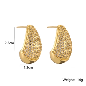 Detail view of gold-plated teardrop earrings with dimensions 2.3cm by 1.3cm and 14g weight