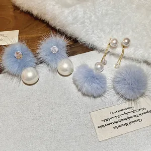 Elegant 18K gold plated pearl earrings with blue-grey faux fur pom poms and zircons