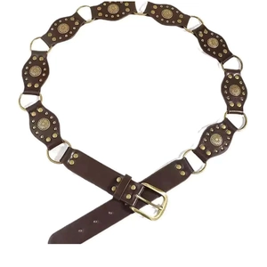 Macro view of vintage brown leather belt with metal ring buckle and sunflower rivets