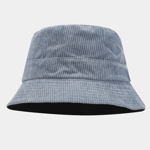 Close-up of gray-blue corduroy bucket hat showing detailed vertical ribbed fabric texture