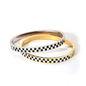 Minimalist gold and silver stainless steel bangles with black and white checkerboard enamel