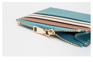 Detail of RFID slim wallet with Saffiano leather texture and golden metal zipper closure