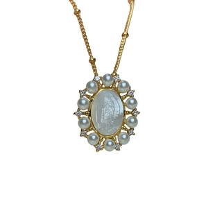 Gold Guadalupe necklace with oval mother of pearl Virgin Mary pendant and crystals