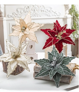 Detailed view of red and white velvet poinsettia flowers with glitter for Christmas trees