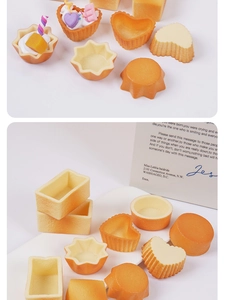 Macro shot of assorted resin cake tart bases in various shapes for DIY dessert crafts