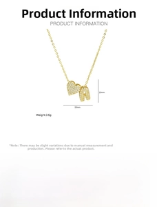 Detail of gold brass heart necklace with letter A pendant and white cubic zirconia