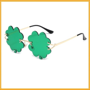 Green shamrock-shaped sunglasses with gold metal frame for festive party decoration