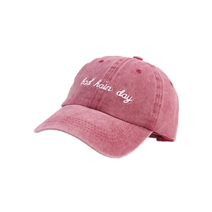 Vintage washed red baseball cap featuring bad hair day embroidery and adjustable soft top