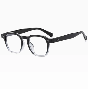 Detailed 45-degree view of square black and clear gradient eyeglass frames with silver rivets
