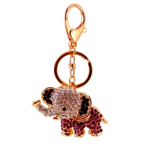 Sparkling elephant keychain with pink and white rhinestones on golden metal base