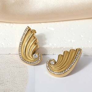18K gold-plated stainless steel wing-shaped earrings with rhinestones on white stone
