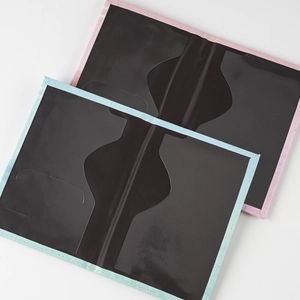 Detail of passport cover showing interior PVC slots and reinforced stitching in soft colors