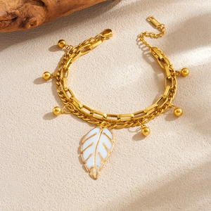 Double-layer stainless steel gold bracelet with white enamel leaf and gold bead charms
