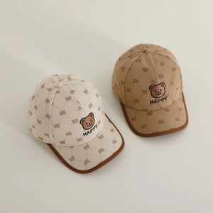 Kids corduroy baseball caps in beige and khaki featuring bear embroidery and happy text