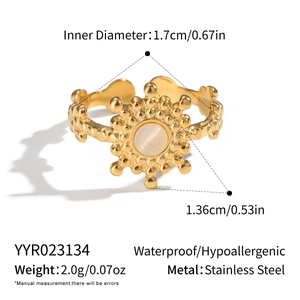 Detailed specs of gold sunflower ring with white stone on stainless steel band