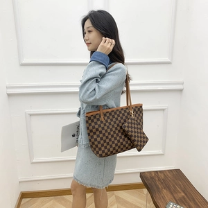 Vintage checkered tote bag with matching pouch, featuring a brown S-logo pattern on a handbag