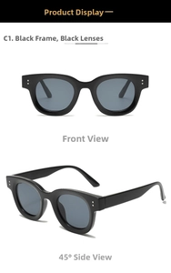 Front and 45-degree angle view of vintage black oval sunglasses with silver rivets