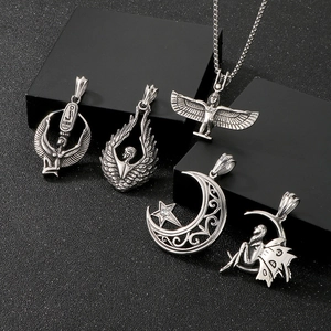 Detailed set of silver stainless steel pendants with ancient Egyptian wing and moon designs