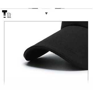 Detail view of the black canvas baseball cap with reinforced sandwich brim structure