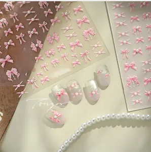 Detailed 3D embossed pink bow nail stickers with pearls for sweet manicure art