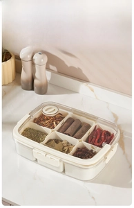 Close-up of divided spice box with 6 compartments and silicone sealing ring for freshness