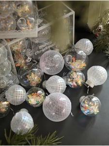 Macro shot of glittery Christmas balls with pearl textures and silver hanging cords