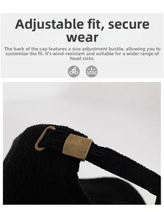 Detail of adjustable antique bronze metal buckle on a black textured baseball cap