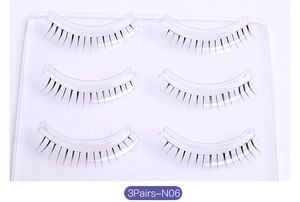 Detailed macro view of 3 pairs of natural N06 false eyelashes on a clear tray